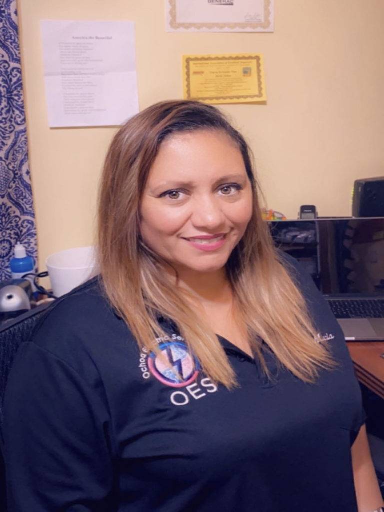 Office manager Maria providing customer support for electrical services Palm Beach County at Ochoa Electric Services.
